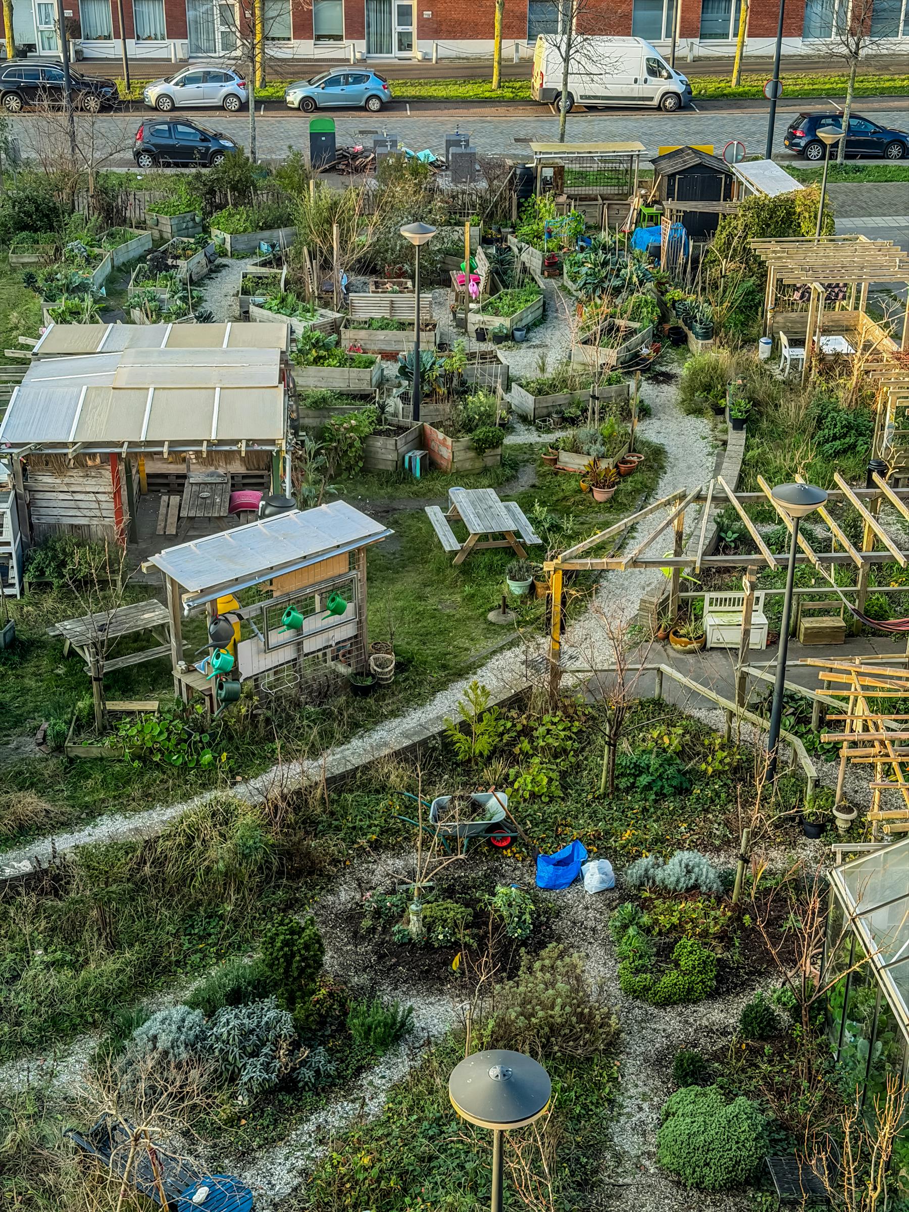 Aerial view of an urban farm and city green plots